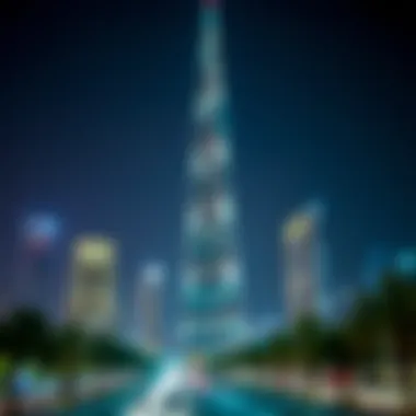 Night view of D1 Tower illuminated, blending with the vibrant city lights of Dubai