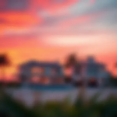 Beautiful sunset over beach mansions with palm trees